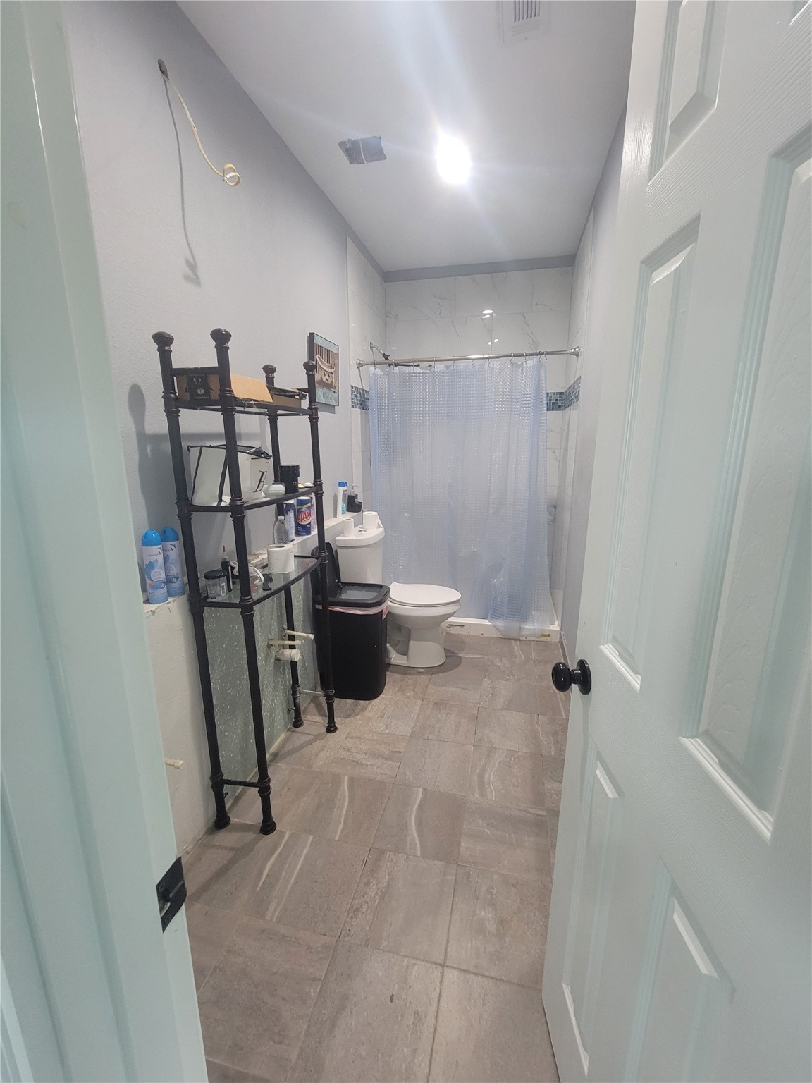 248 County Road 3572 Cleveland, TX 77327 - Photo 19 of 29 a view of a storage & utility room with stuff