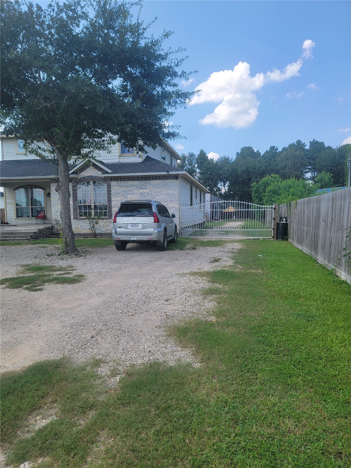 248 County Road 3572 Cleveland, TX 77327 - Photo 2 of 29 a view of street with parked cars