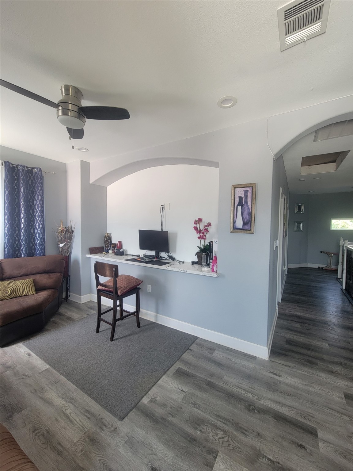 248 County Road 3572 Cleveland, TX 77327 - Photo 21 of 29 a living room with furniture and a wooden floor