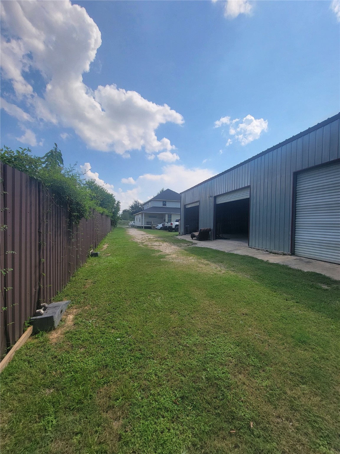 248 County Road 3572 Cleveland, TX 77327 - Photo 27 of 29 a view of a backyard with garden