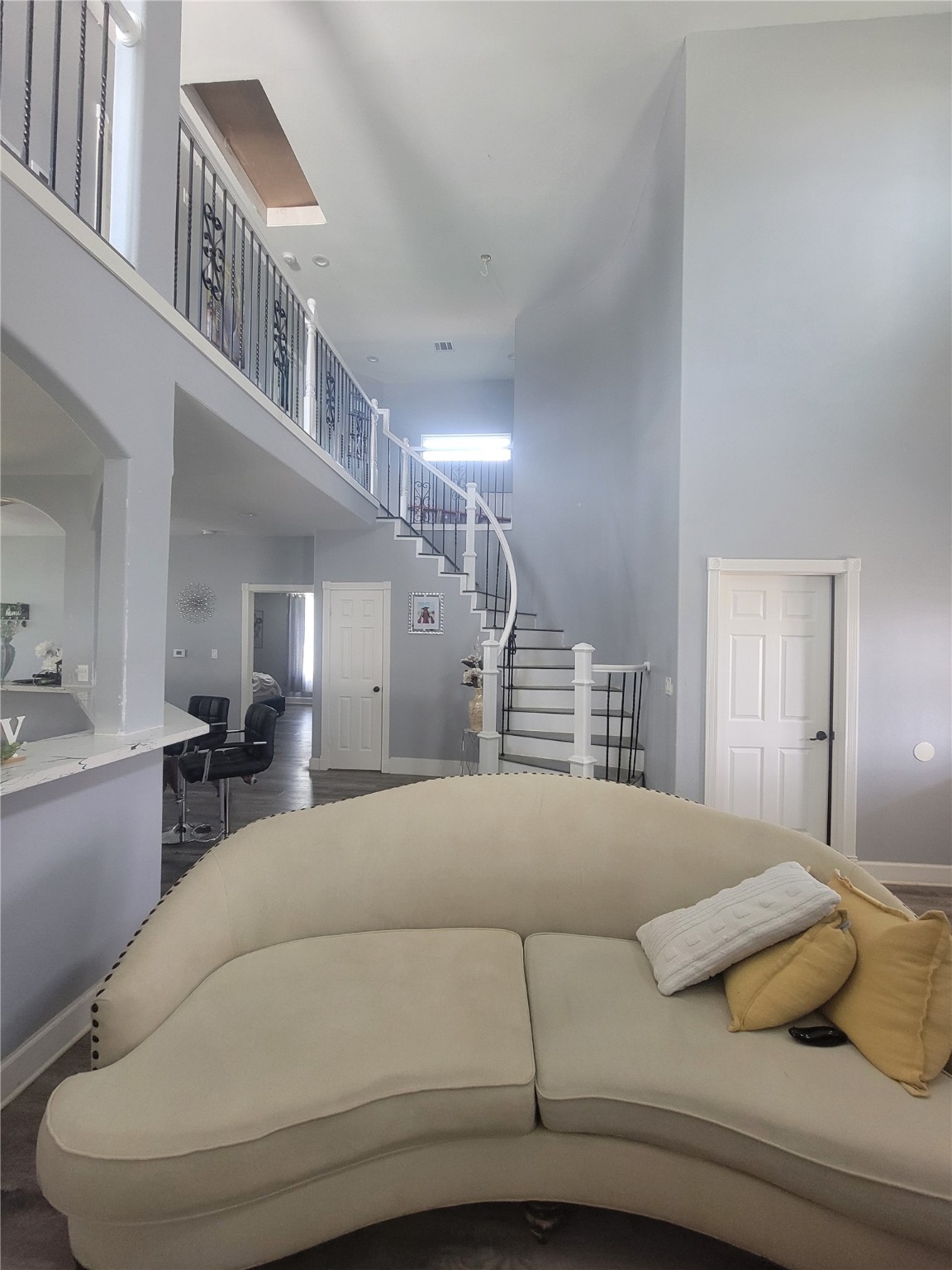 248 County Road 3572 Cleveland, TX 77327 - Photo 5 of 29 a bedroom with a large bed and a chandelier