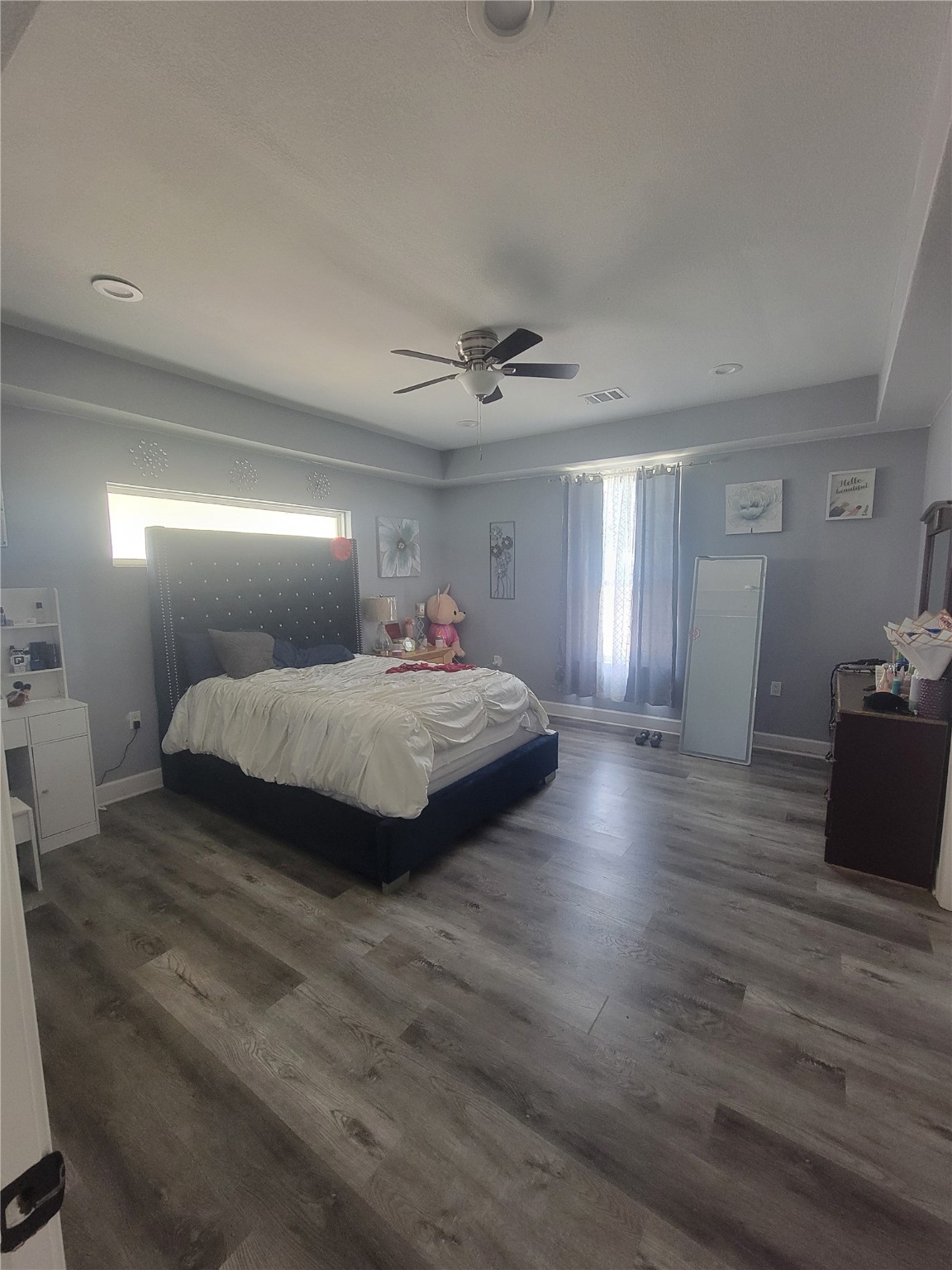 248 County Road 3572 Cleveland, TX 77327 - Photo 10 of 29 a bedroom with a bed and a ceiling fan