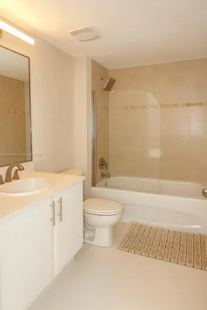 a bathroom with a sink a toilet and a bathtub