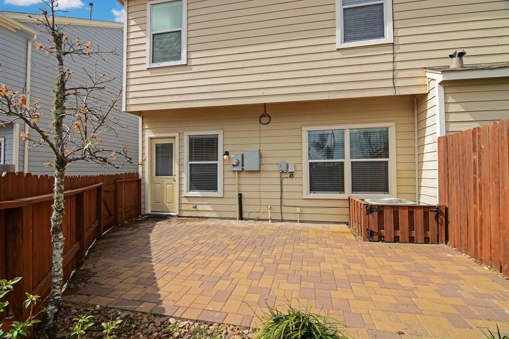 3508 Glenmore Meadow Drive Spring, TX 77386 - Photo 11 of 13 a view of a house with a large window and wooden fence