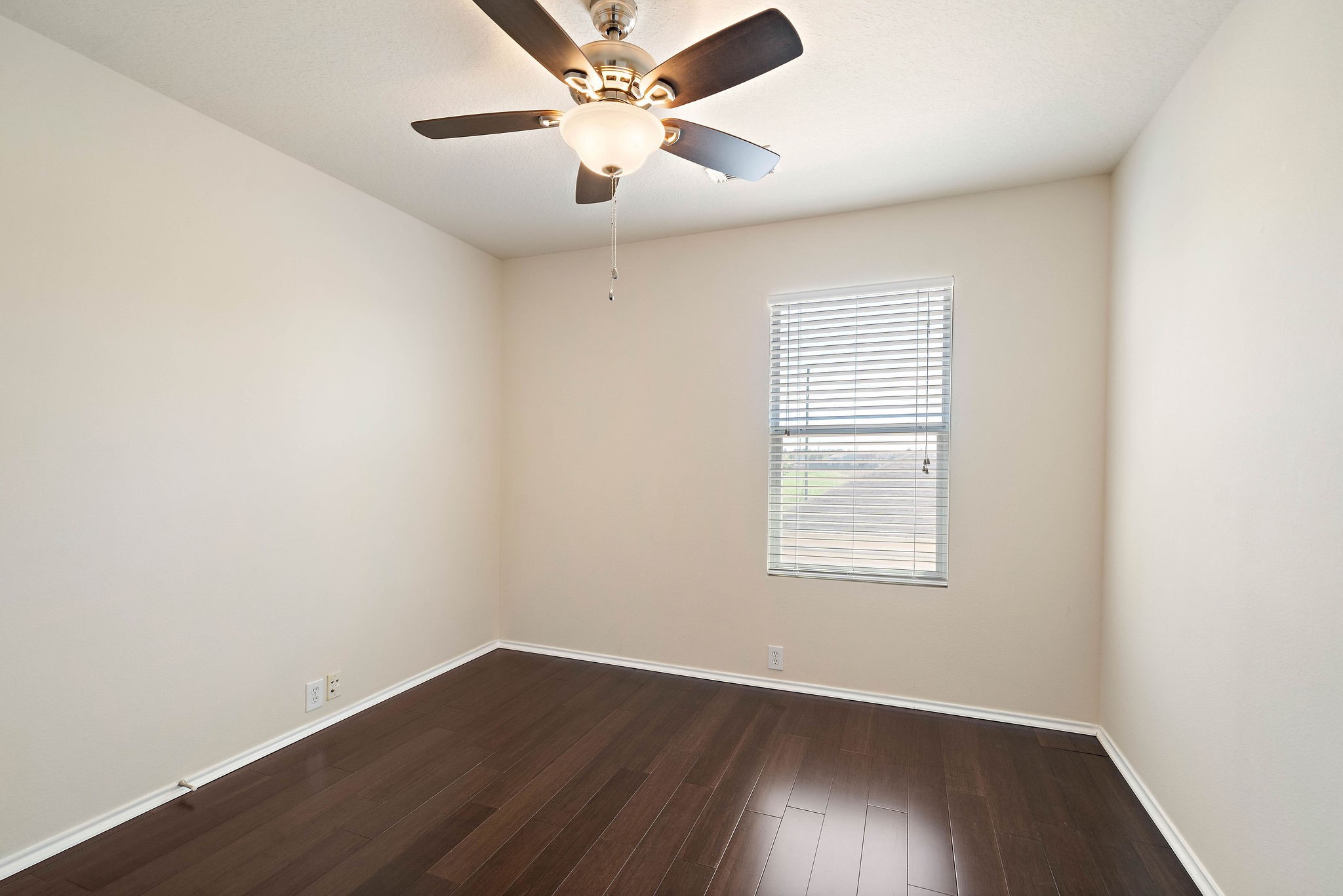 3508 Glenmore Meadow Drive Spring, TX 77386 - Photo 7 of 13 an empty room with wooden floor and windows