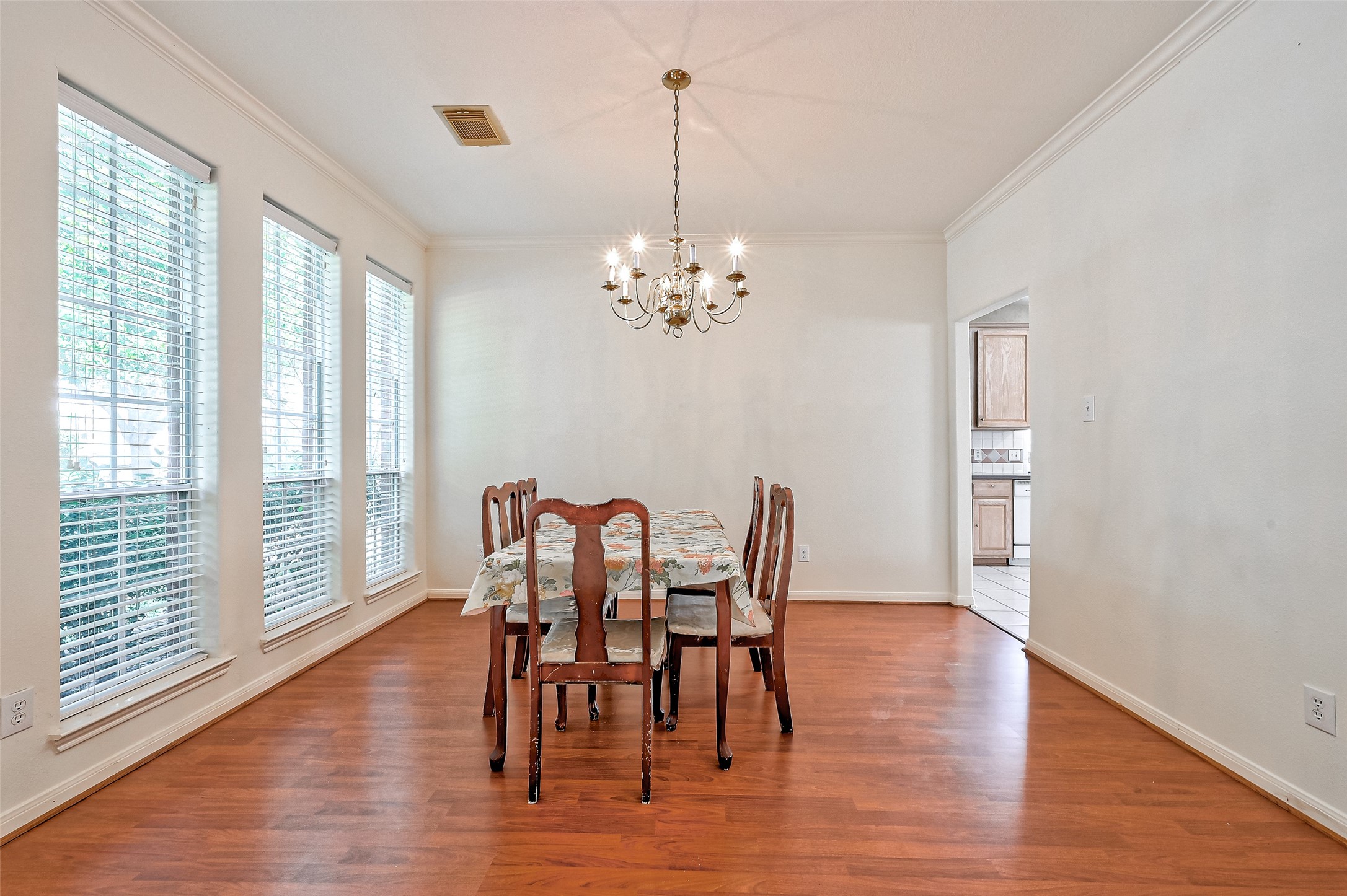 6806 Rhodes Court Missouri City, TX 77459 - Photo 11 of 50 a view of a dining room with furniture window and wooden floor
