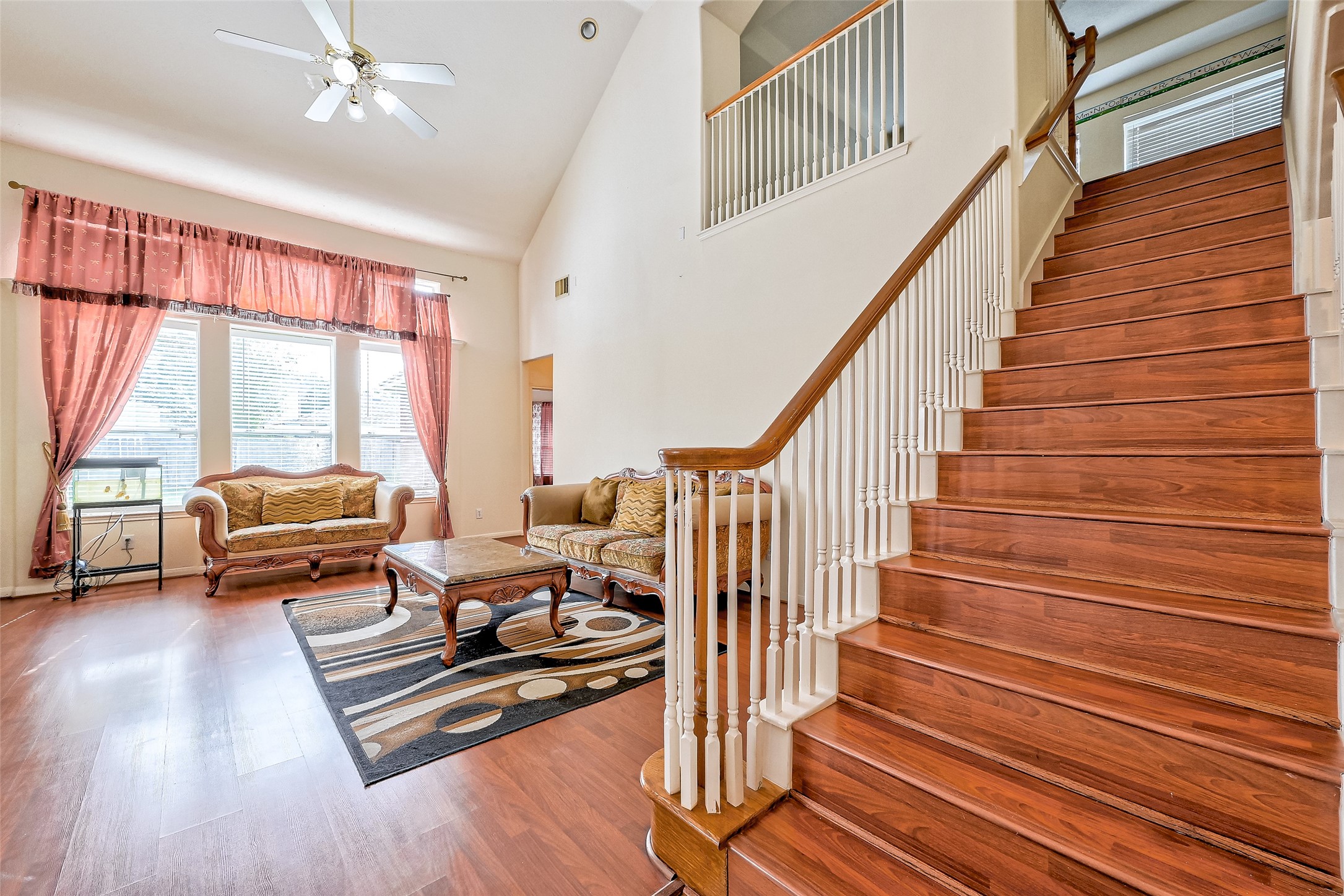 6806 Rhodes Court Missouri City, TX 77459 - Photo 12 of 50 a living room with furniture and a large window