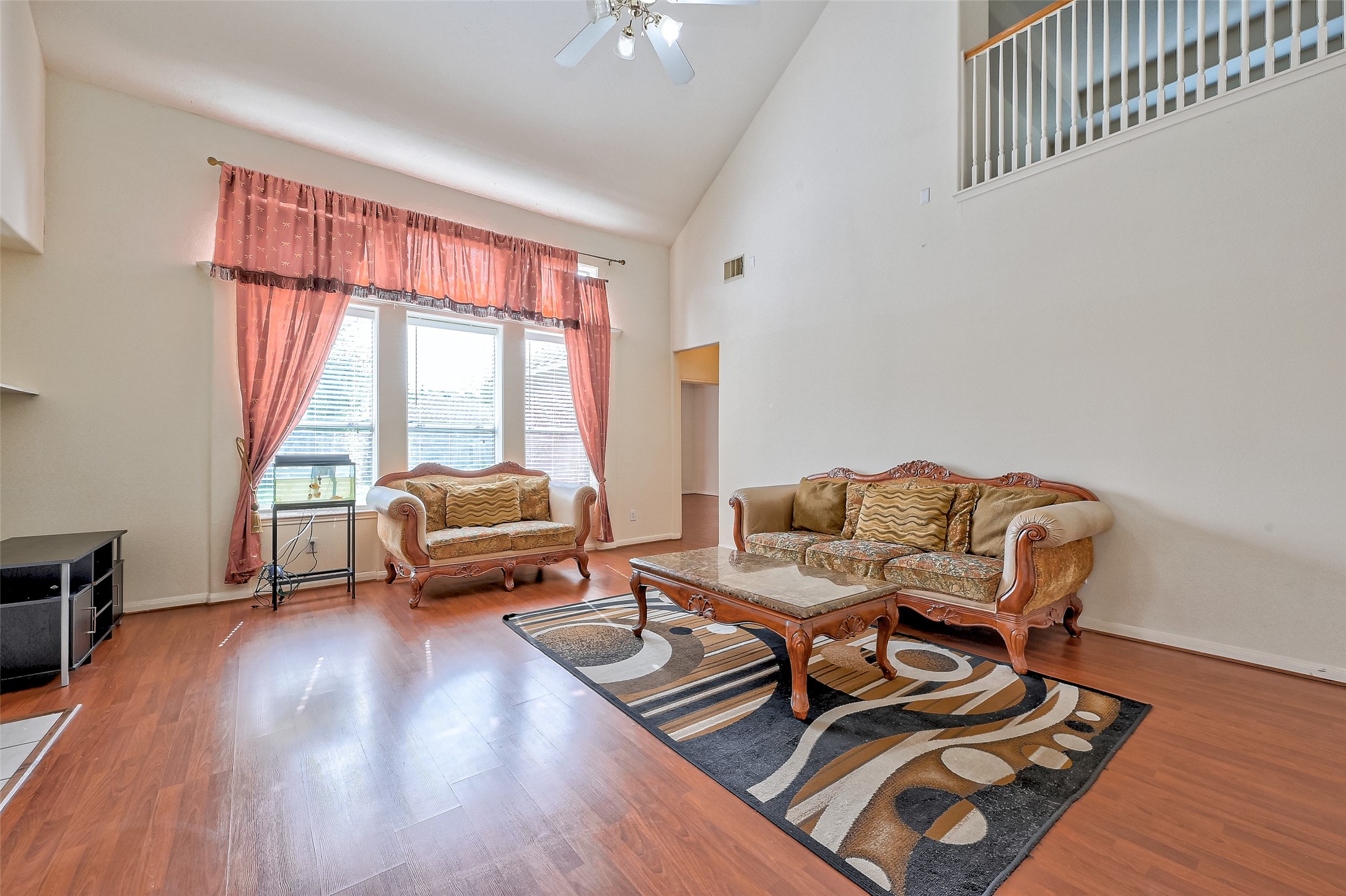 6806 Rhodes Court Missouri City, TX 77459 - Photo 13 of 50 a living room with furniture and a large window