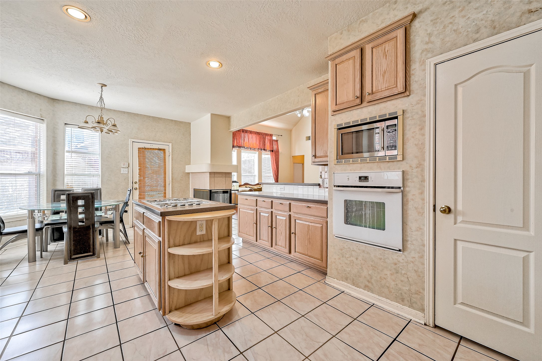 6806 Rhodes Court Missouri City, TX 77459 - Photo 17 of 50 a kitchen with stainless steel appliances granite countertop a stove a sink and a refrigerator