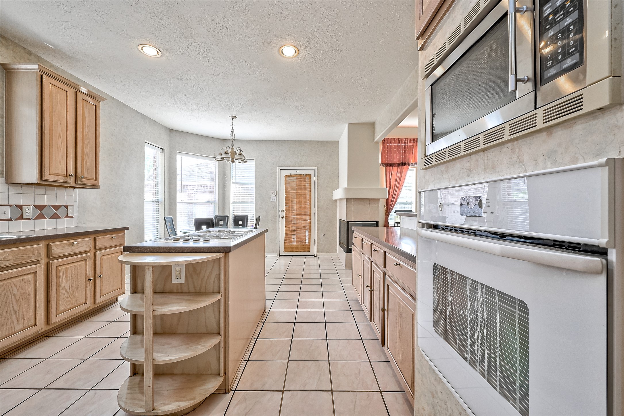 6806 Rhodes Court Missouri City, TX 77459 - Photo 18 of 50 a kitchen with stainless steel appliances granite countertop a sink and cabinets