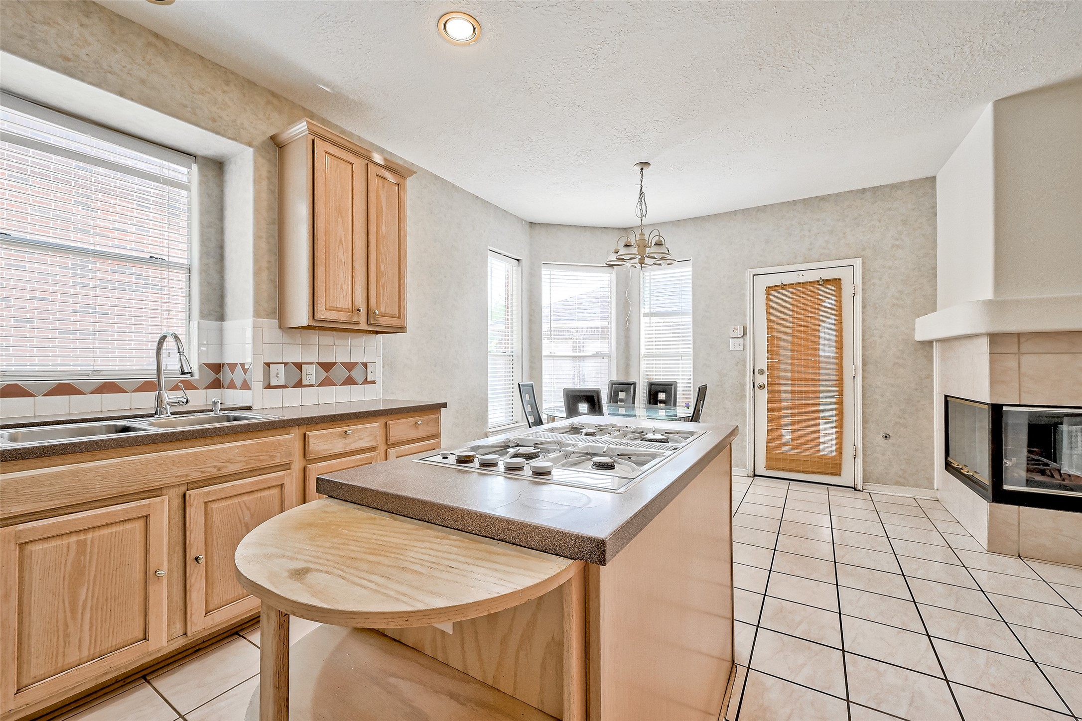 6806 Rhodes Court Missouri City, TX 77459 - Photo 19 of 50 a kitchen with stainless steel appliances granite countertop a stove a sink dishwasher a stove with white cabinets and wooden floor