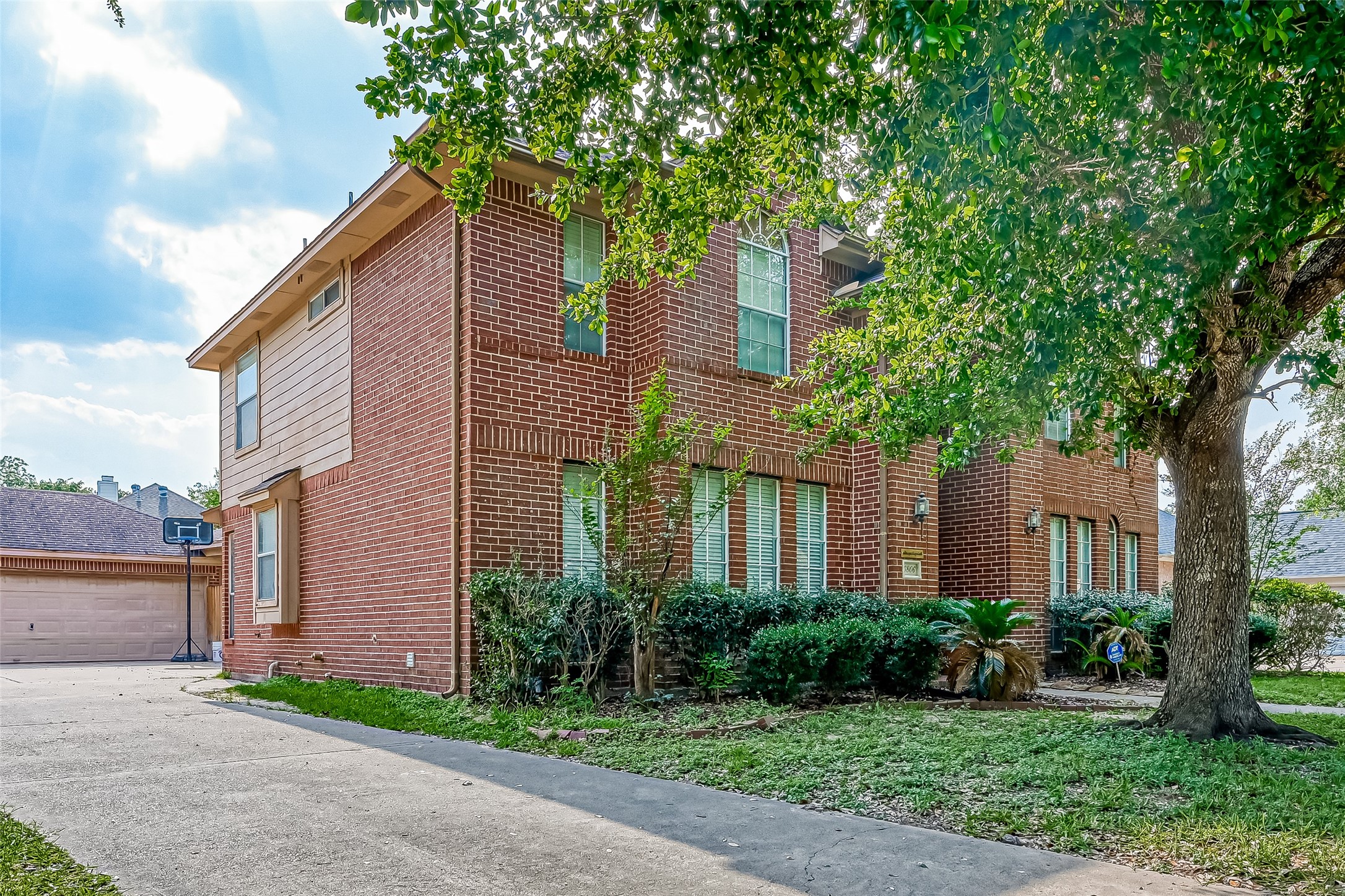 6806 Rhodes Court Missouri City, TX 77459 - Photo 2 of 50 a front view of a house with a yard and potted plants