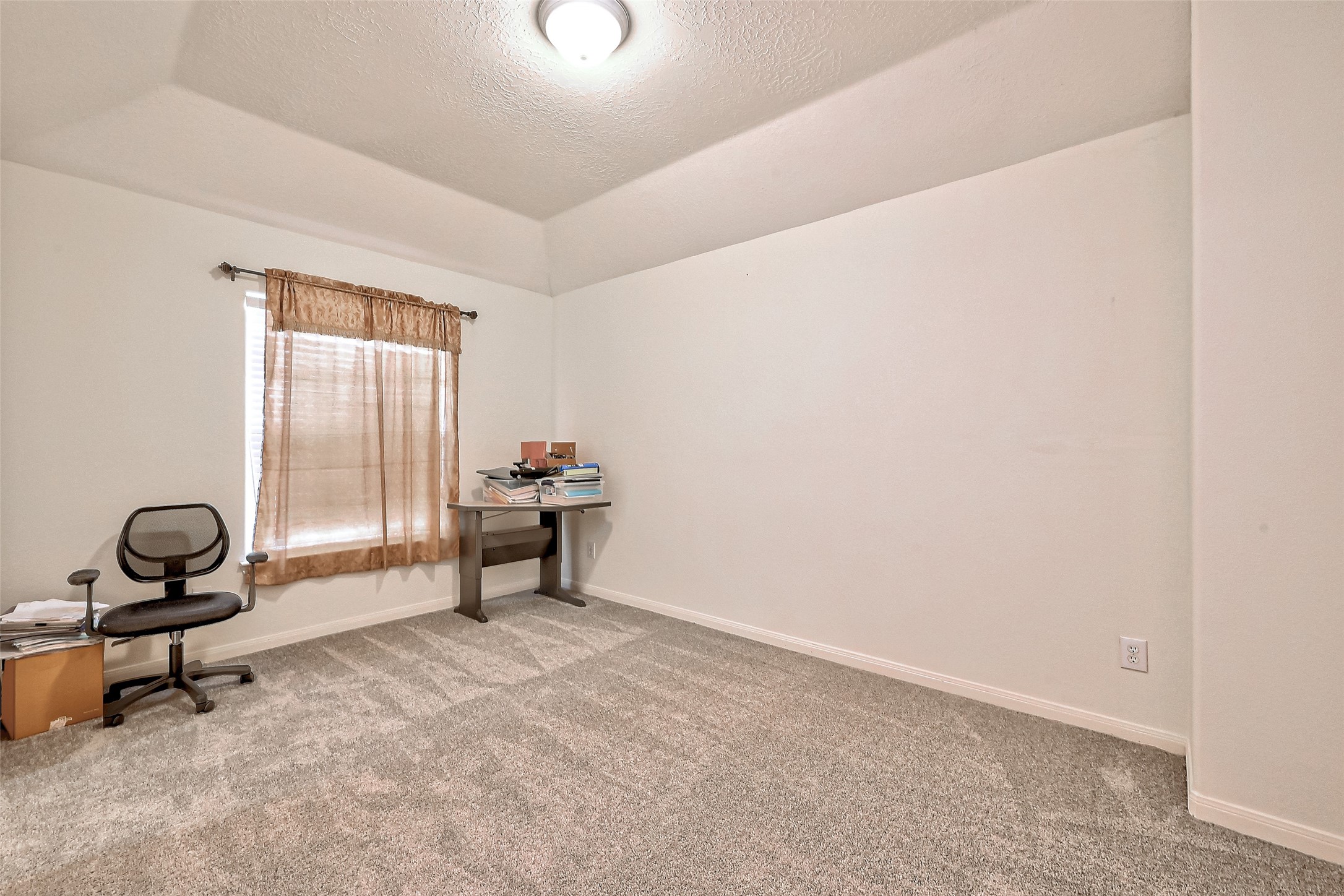 6806 Rhodes Court Missouri City, TX 77459 - Photo 36 of 50 a living room with a window