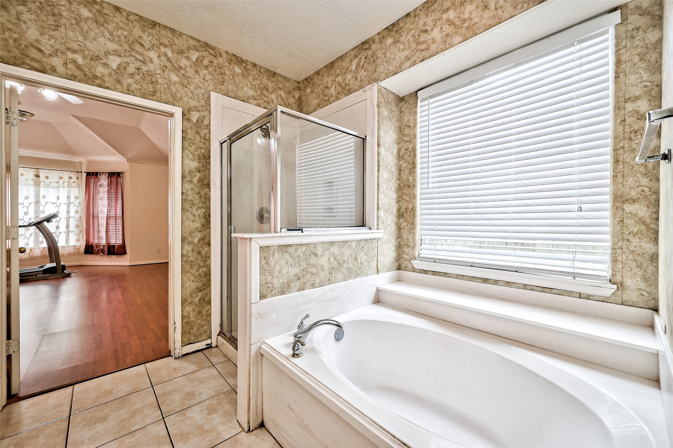 6806 Rhodes Court Missouri City, TX 77459 - Photo 42 of 50 a bathroom with a bathtub and a shower