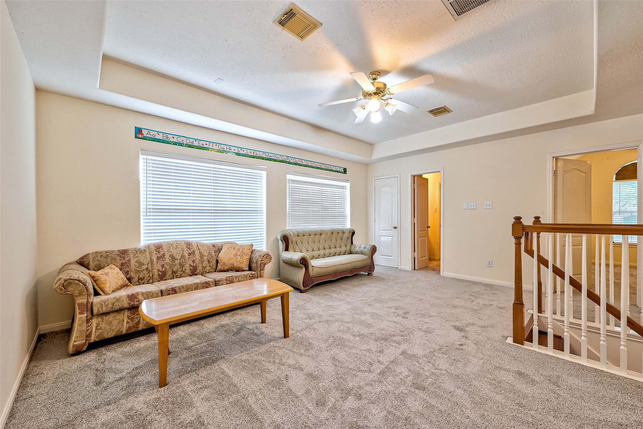 6806 Rhodes Court Missouri City, TX 77459 - Photo 44 of 50 a living room with furniture and a chandelier