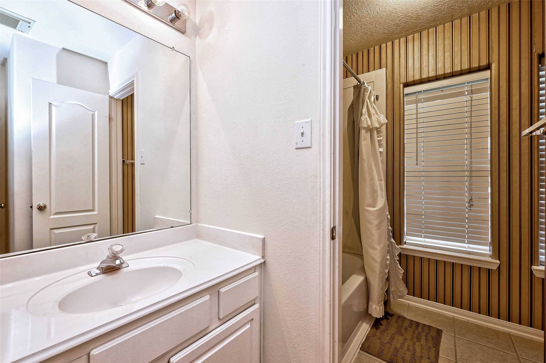6806 Rhodes Court Missouri City, TX 77459 - Photo 47 of 50 a bathroom with a sink and a mirror