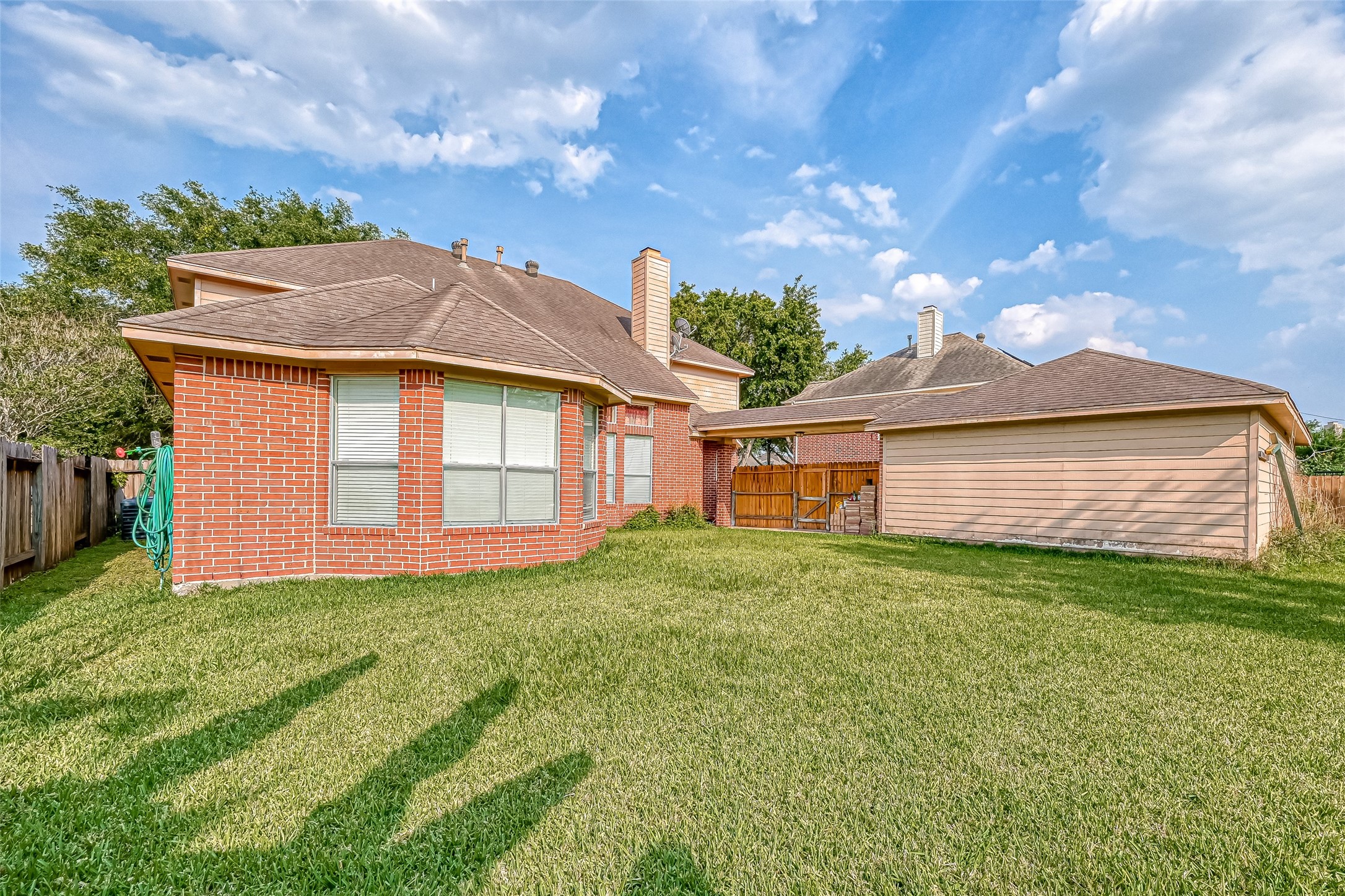 6806 Rhodes Court Missouri City, TX 77459 - Photo 50 of 50 a view of front of a house with a yard