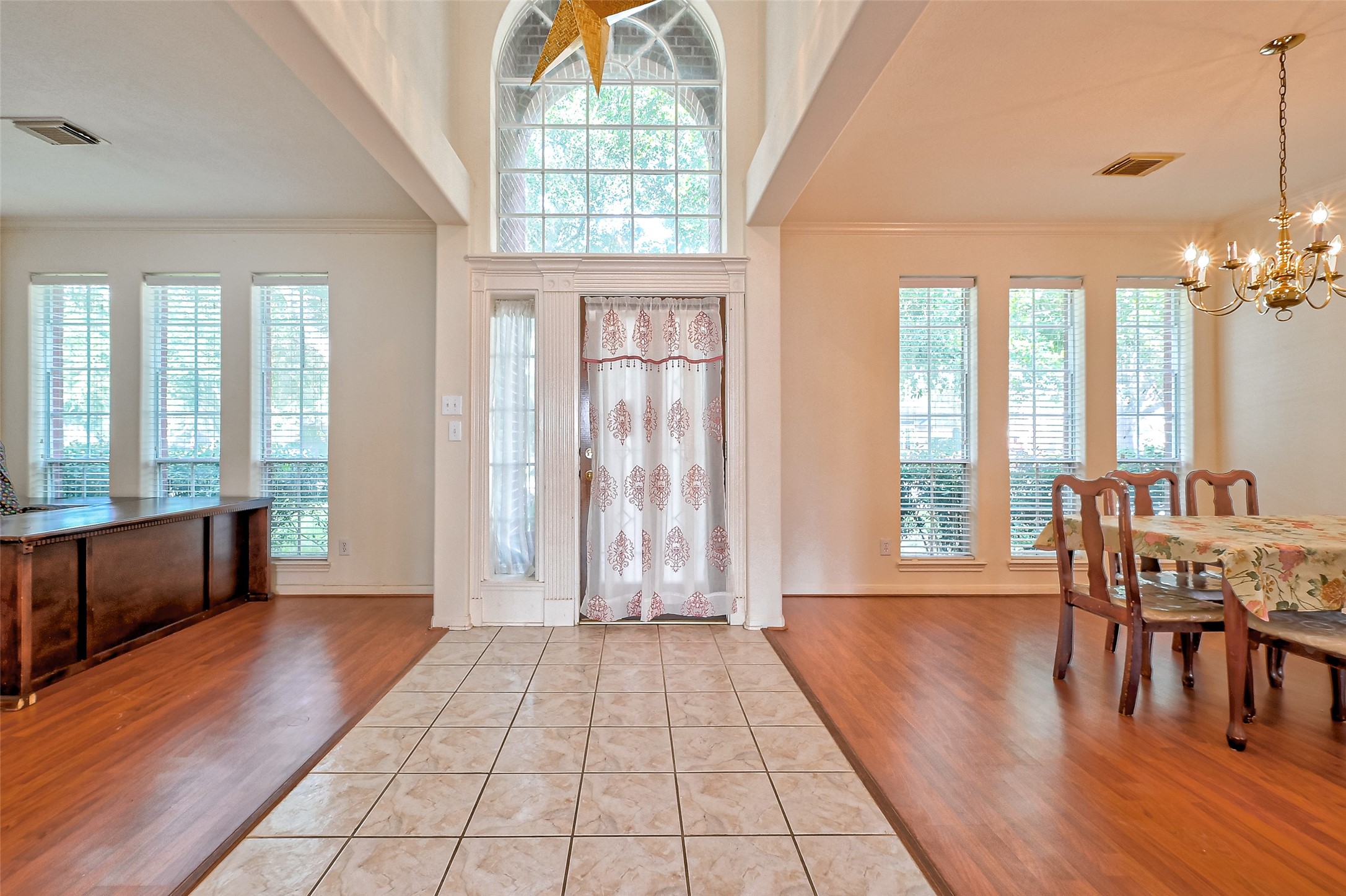 6806 Rhodes Court Missouri City, TX 77459 - Photo 6 of 50 a view of a livingroom with furniture window and wooden floor