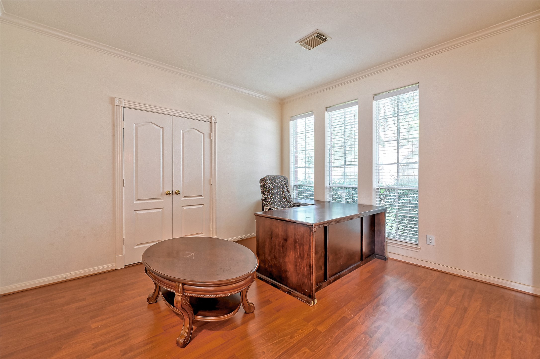 6806 Rhodes Court Missouri City, TX 77459 - Photo 7 of 50 a living room with furniture a table and wooden floor