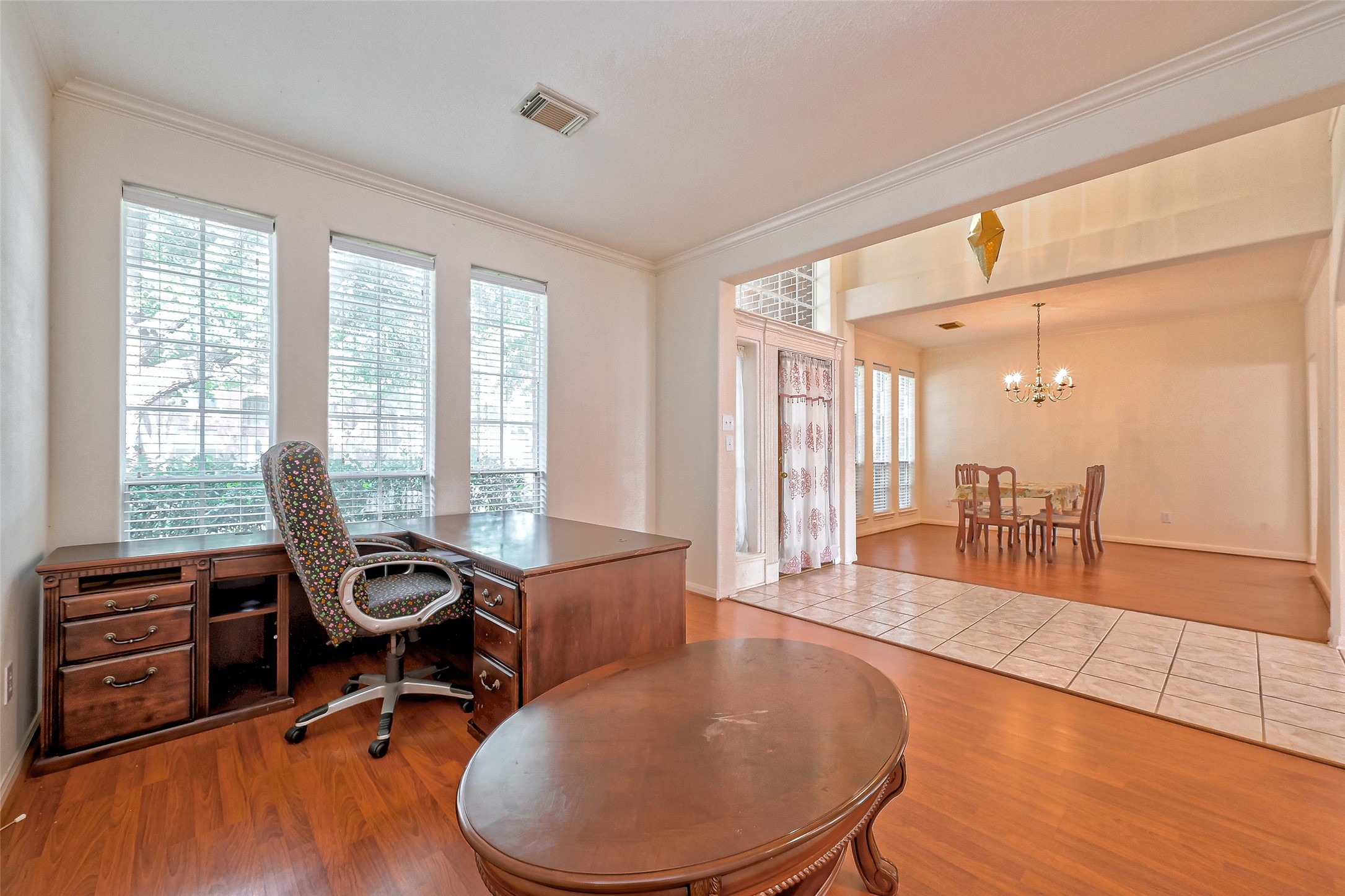 6806 Rhodes Court Missouri City, TX 77459 - Photo 8 of 50 a view of a workspace with furniture and a window