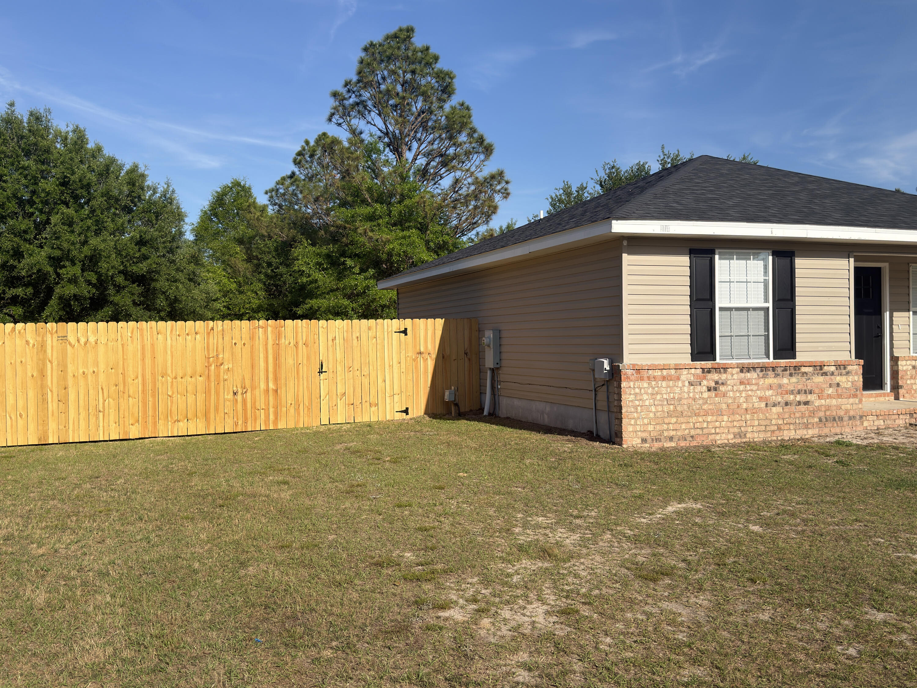 6121 Robin Road Crestview, FL 32539 - Photo 23 of 26 a view of a house with a yard