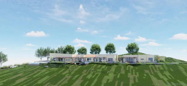 a view of a white house with a yard and sitting area