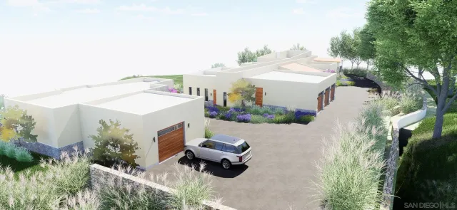 an aerial view of a house with yard and outdoor seating