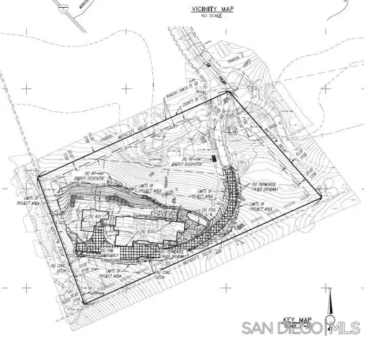 a aerial view of a house with swimming pool and sitting area