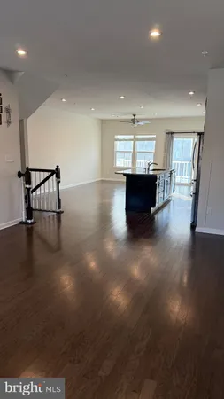 a view of dining room with furniture and wooden floor