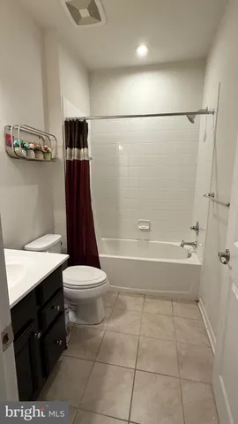 a bathroom with a toilet a sink and bathtub