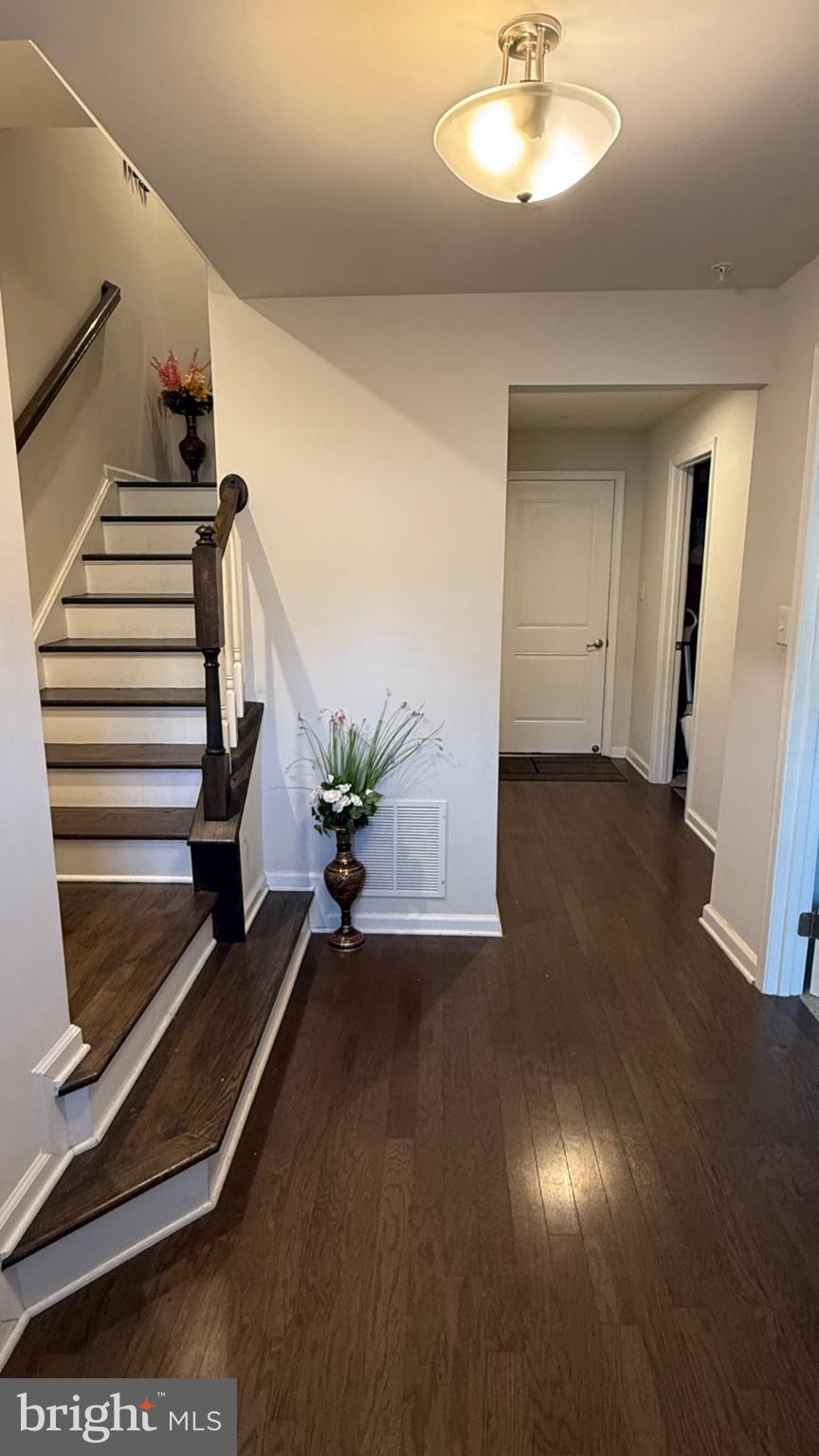 743 Quarry Road Malvern, PA 19355 - Photo 2 of 20 an empty room with wooden floor and windows