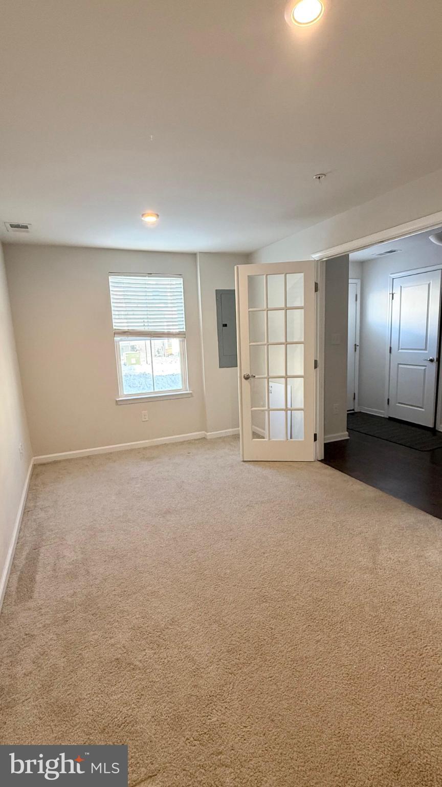 743 Quarry Road Malvern, PA 19355 - Photo 3 of 20 an empty room with windows