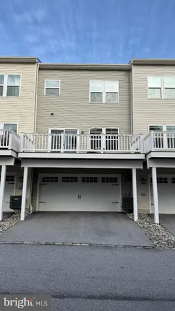 a view of a chairs and table on the balcony