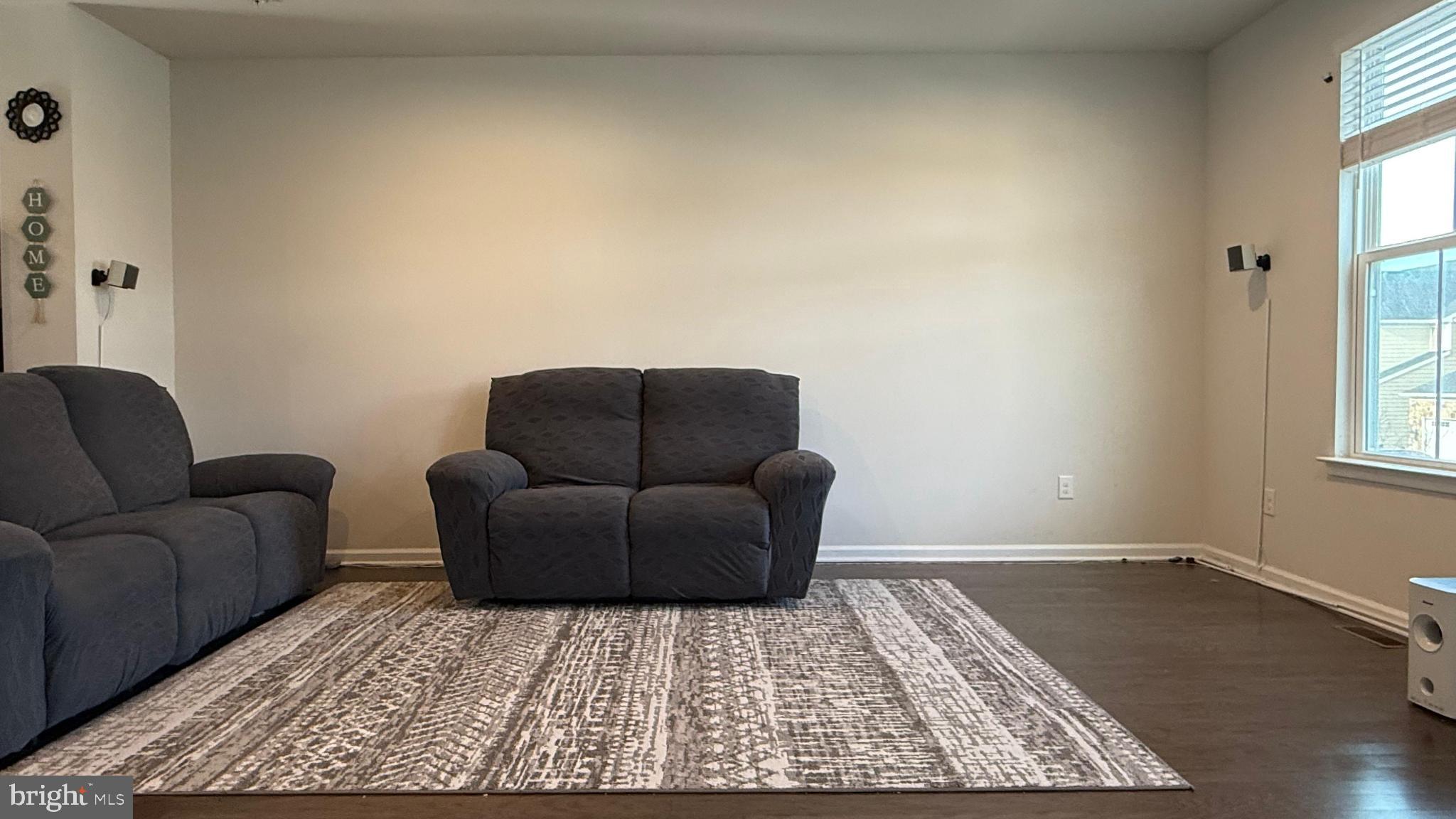 743 Quarry Road Malvern, PA 19355 - Photo 5 of 20 a living room with furniture and a rug