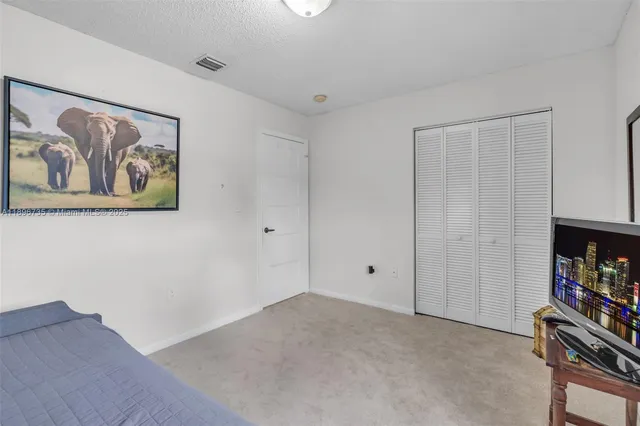 a view of room with toys and ceiling fan