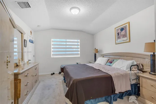 a bedroom with a bed and a cabinets
