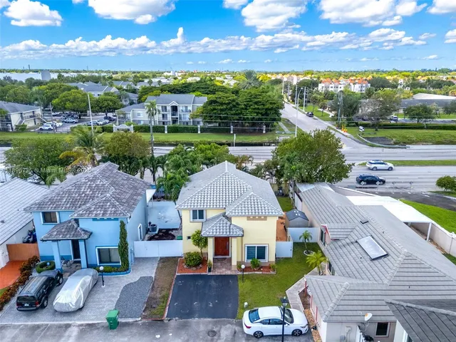 aerial view of a house with a big yard