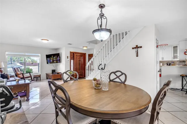 a dining room with furniture and window