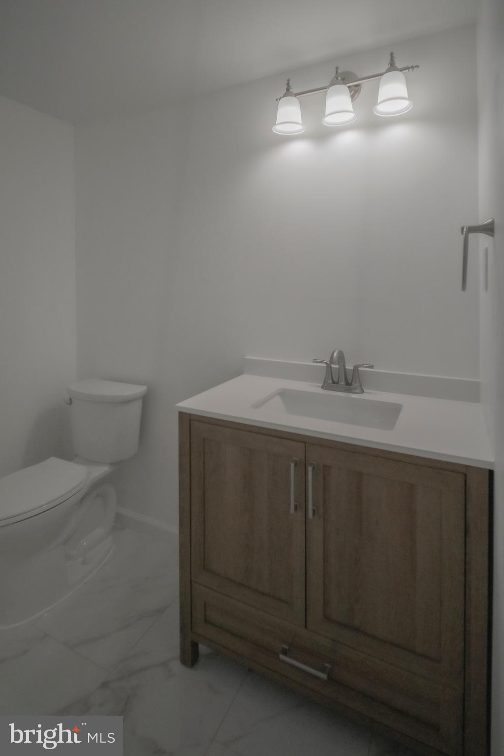 125 North Shore Road Marmora, NJ 08223 - Photo 15 of 26 a bathroom with a sink and a mirror