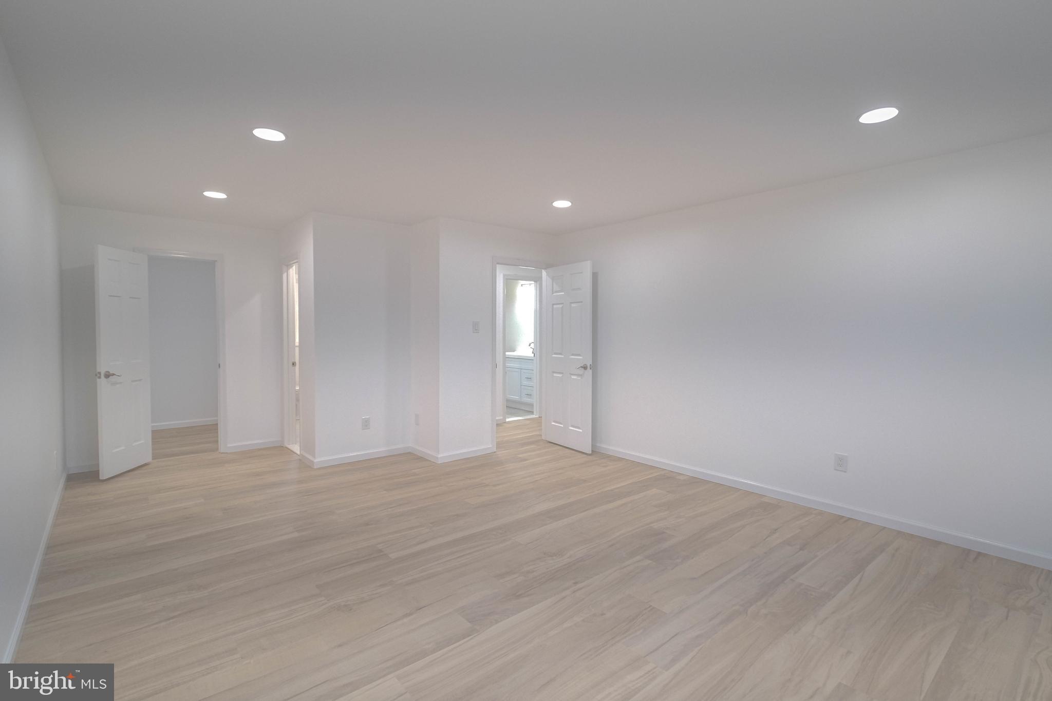 125 North Shore Road Marmora, NJ 08223 - Photo 16 of 26 a view of an empty room with wooden floor and a window