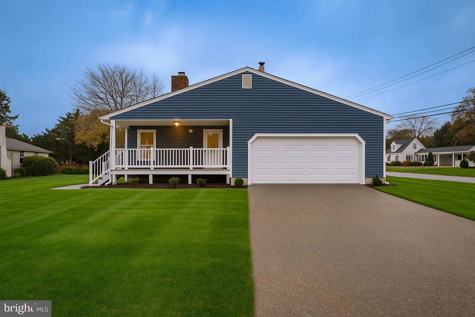 125 North Shore Road Marmora, NJ 08223 - Photo 4 of 26 a front view of house with yard and green space
