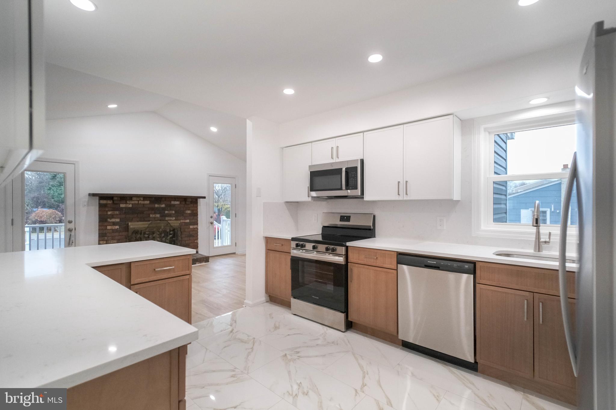 125 North Shore Road Marmora, NJ 08223 - Photo 7 of 26 a large kitchen with stainless steel appliances granite countertop a sink and a stove