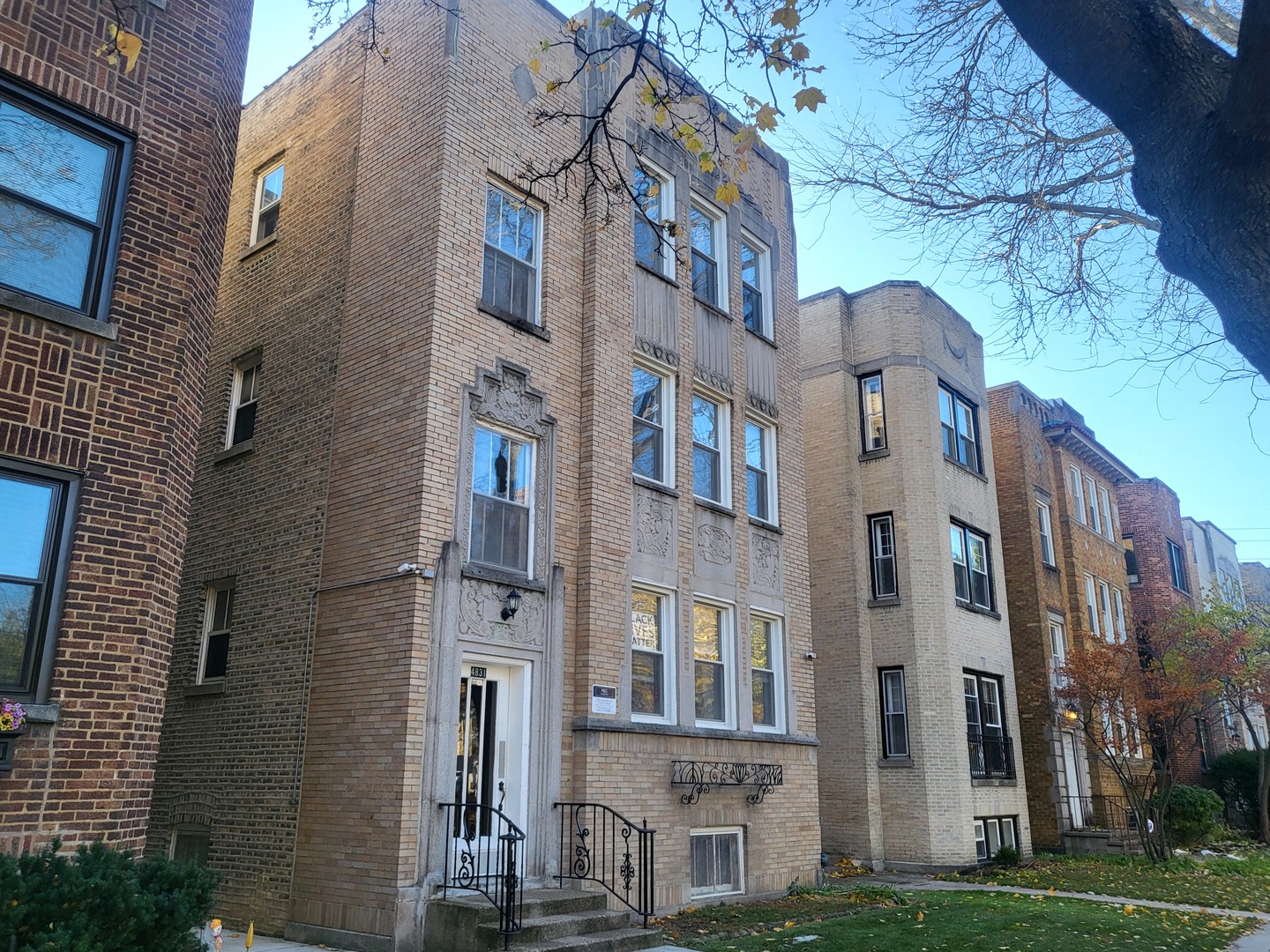 a view of a building with a yard