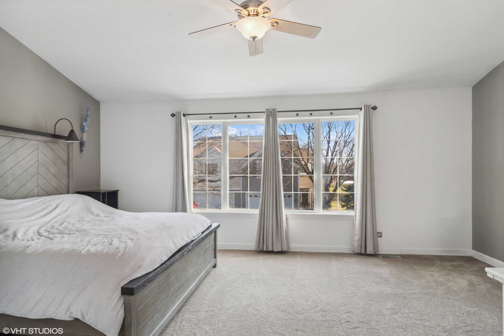 1545 Spaulding Road Bartlett, IL 60103 - Photo 11 of 21 a bedroom with a bed and a large window with the outer view