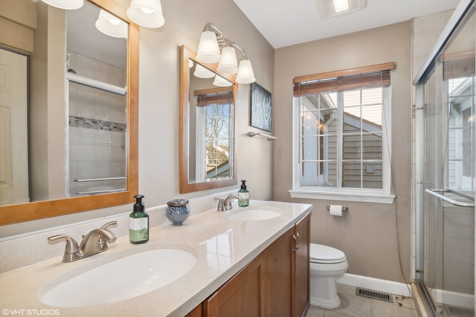 1545 Spaulding Road Bartlett, IL 60103 - Photo 13 of 21 a bathroom with a granite countertop sink mirror vanity and a toilet