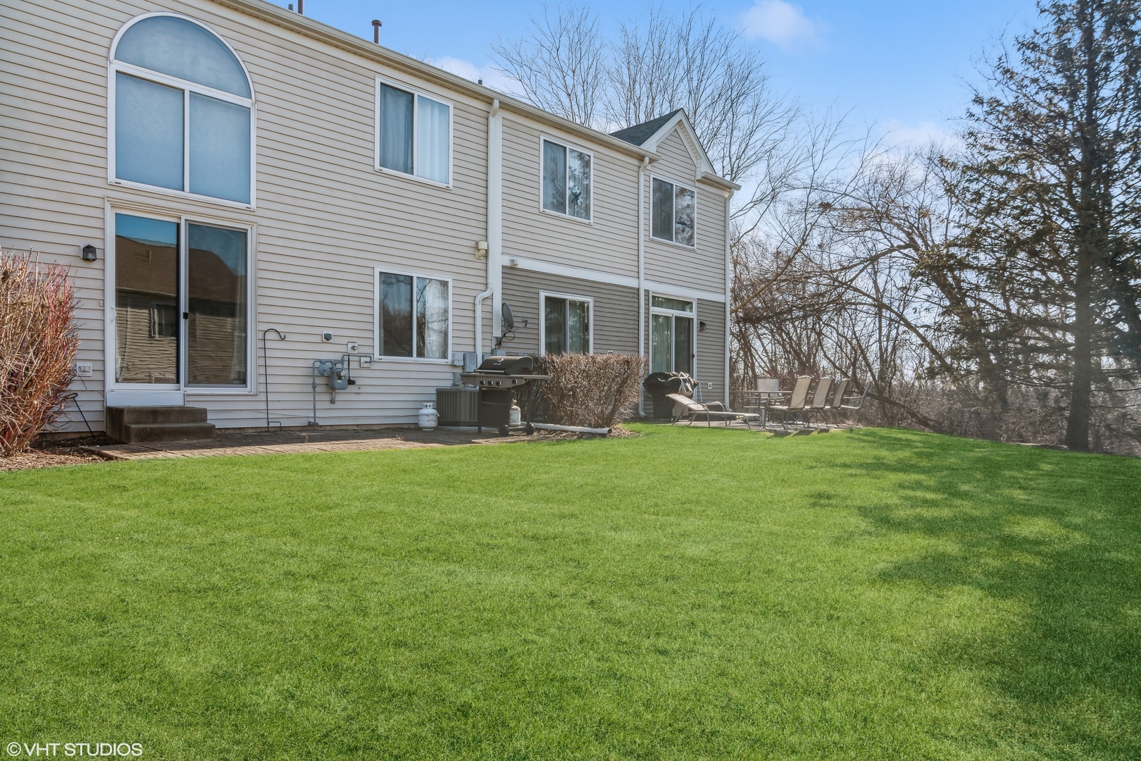 1545 Spaulding Road Bartlett, IL 60103 - Photo 17 of 21 a front view of house with yard and outdoor seating