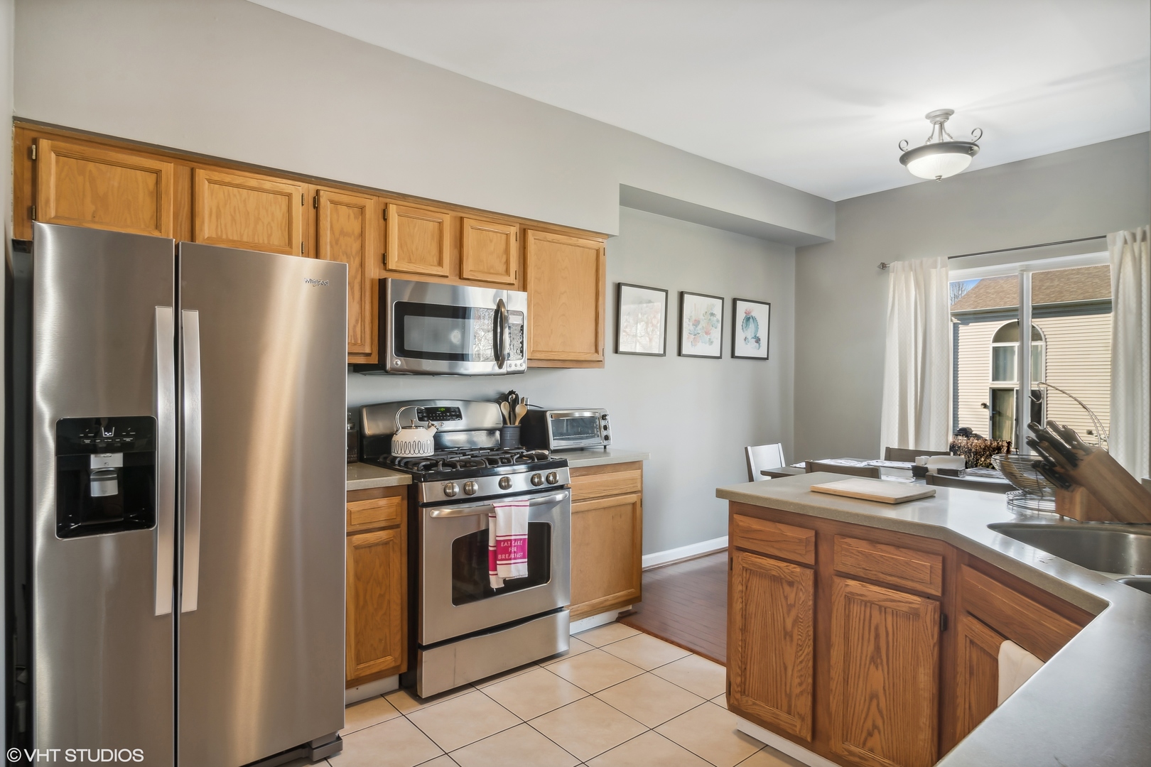 1545 Spaulding Road Bartlett, IL 60103 - Photo 6 of 21 a kitchen with stainless steel appliances granite countertop a refrigerator stove and sink