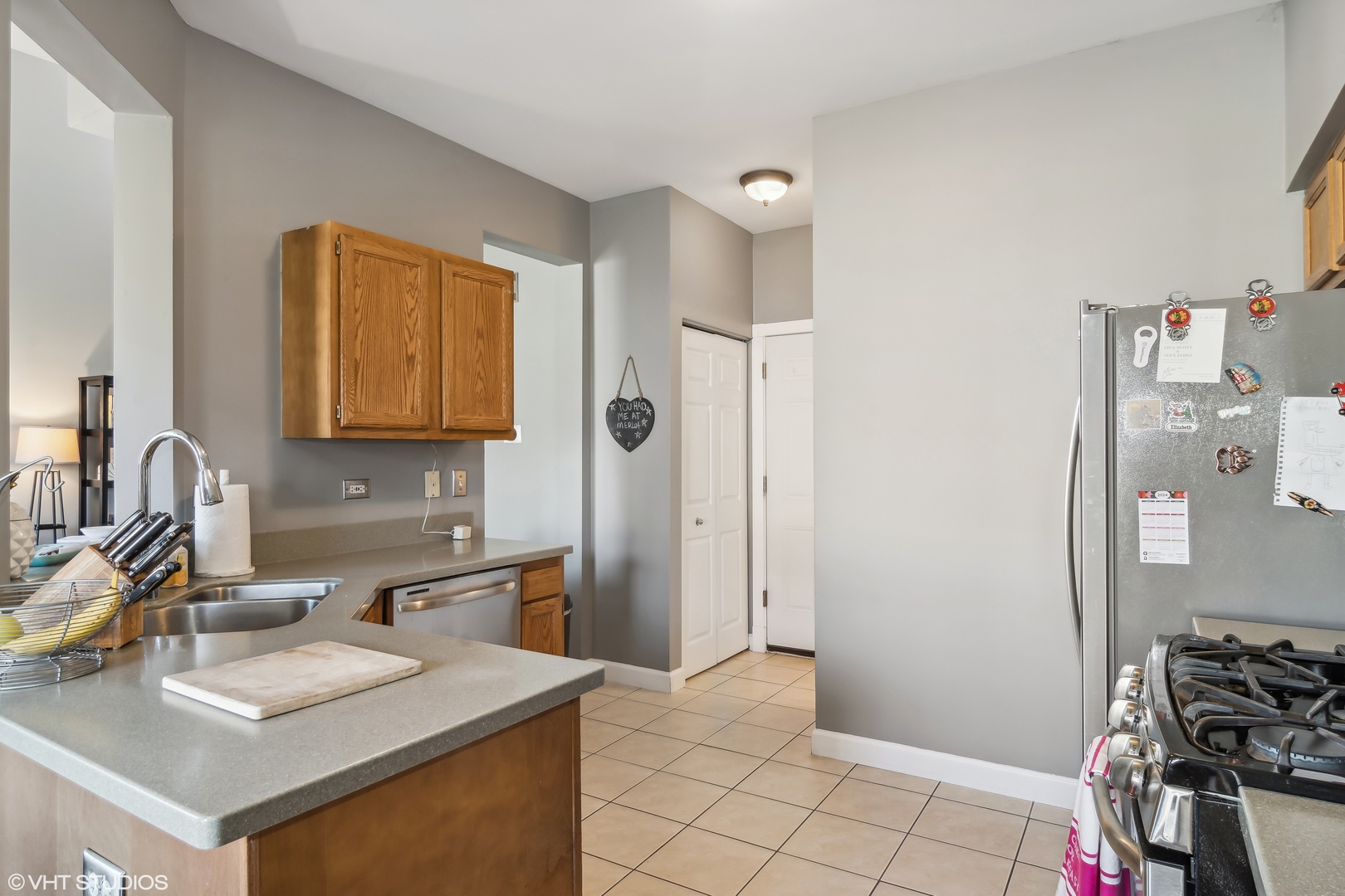 1545 Spaulding Road Bartlett, IL 60103 - Photo 7 of 21 a kitchen with stainless steel appliances granite countertop a sink stove and refrigerator