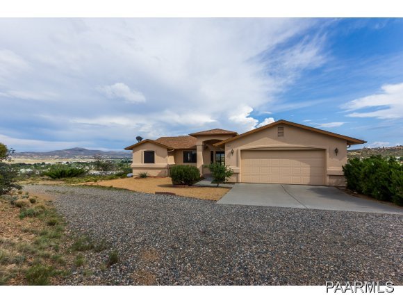 11801 Henderson Road Dewey-Humboldt, AZ 86327 - Photo 1 of 19 a front view of a house with a yard