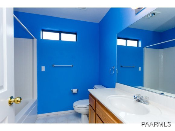 11801 Henderson Road Dewey-Humboldt, AZ 86327 - Photo 11 of 19 a bathroom with a sink a toilet and mirror